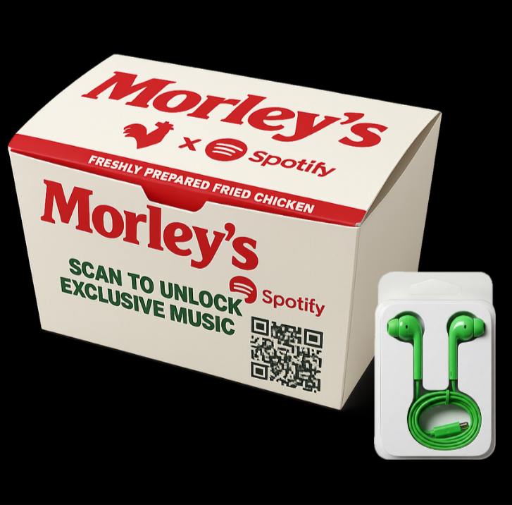 Morley's chicken mascot wearing green headphones next to the takeaway box