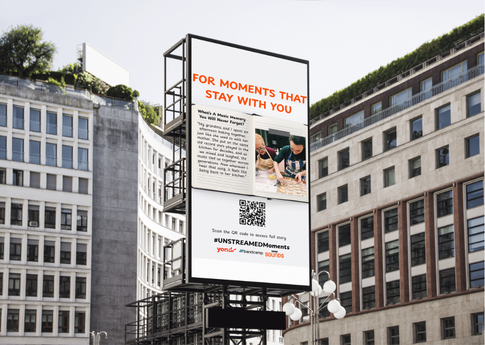 City billboard reading 'For moments that stay with you' displaying a submitted music memory story